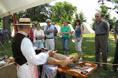 Photo of a demonstration of Civil War era medicine and surgery.