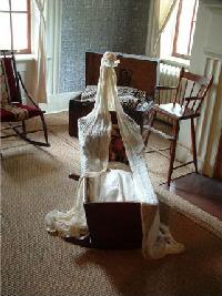 Photo of an antique cradle. (14k)